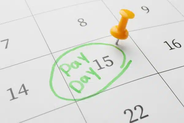 Small business owner managing late client payments